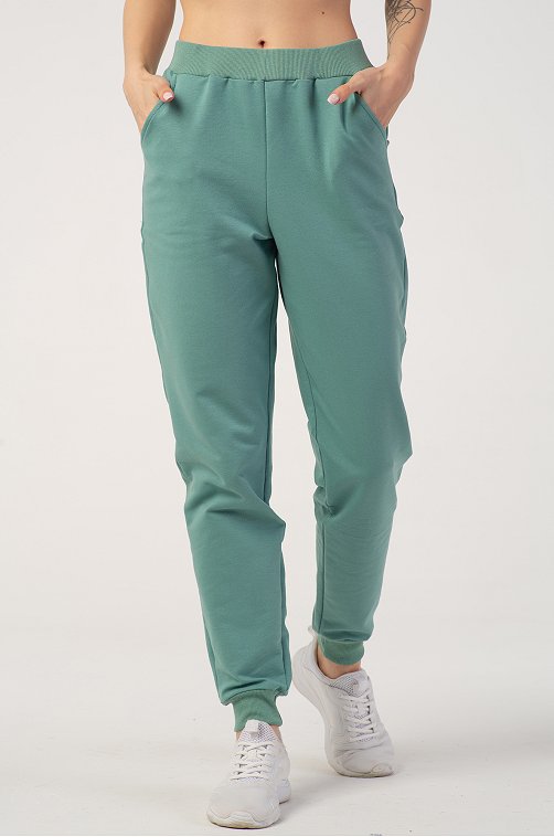 Однотонные женские спортивные брюки 6632105 зеленый  оптом в .